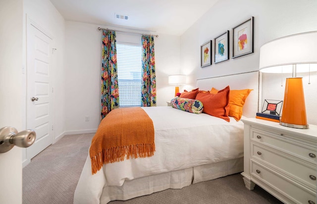 bedroom with light carpet