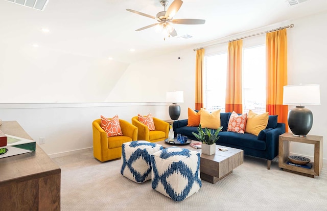 carpeted living room with vaulted ceiling and ceiling fan