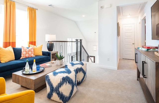 carpeted living room featuring lofted ceiling