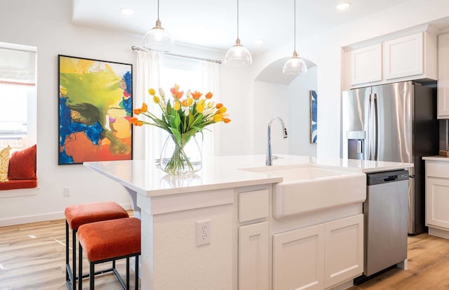 kitchen featuring sink, white cabinetry, and dishwasher