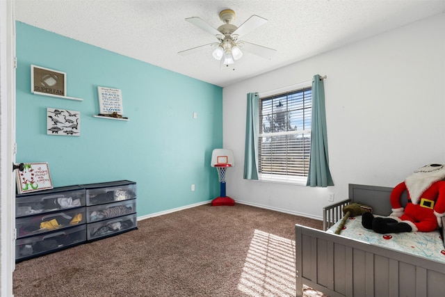 bedroom with ceiling fan, carpet, and a textured ceiling