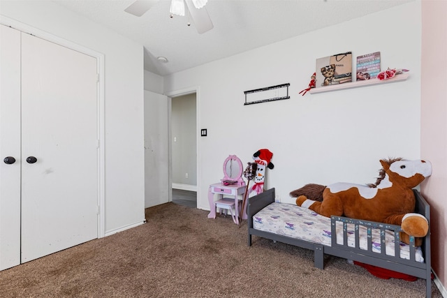 carpeted bedroom with a closet and ceiling fan