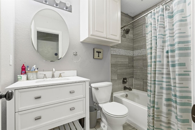 full bathroom with shower / tub combo with curtain, vanity, a textured ceiling, and toilet