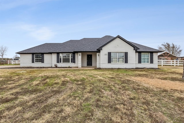 ranch-style house with a front lawn