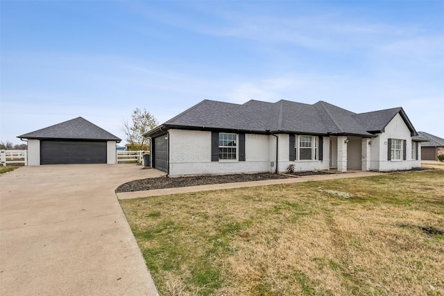 view of front of house featuring a garage and a front yard