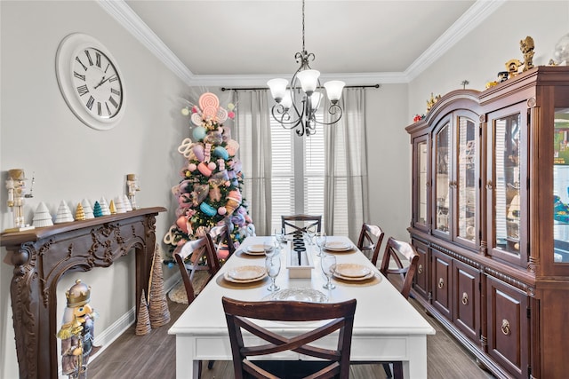 dining room featuring dark hardwood / wood-style floors, crown molding, and an inviting chandelier