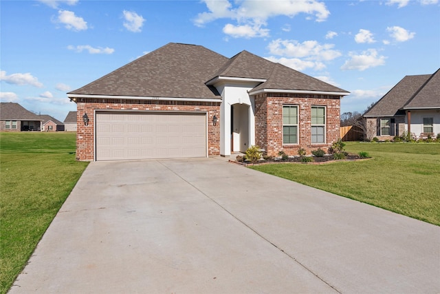 view of front facade featuring a front yard and a garage