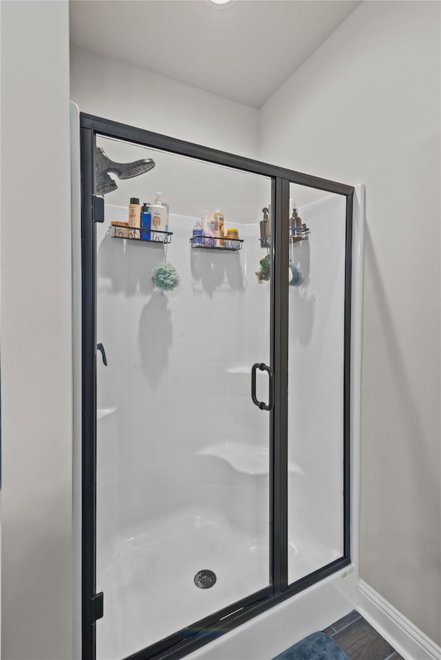 bathroom featuring an enclosed shower