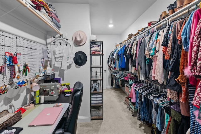 spacious closet with light carpet