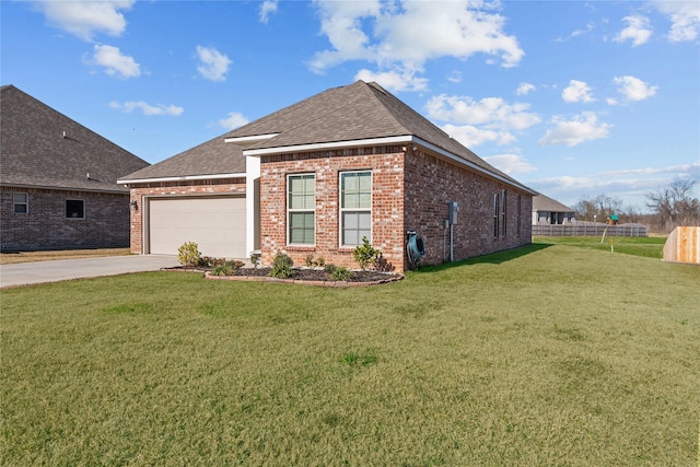 view of front of property with a garage and a front lawn