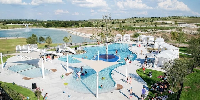 view of swimming pool with a water view