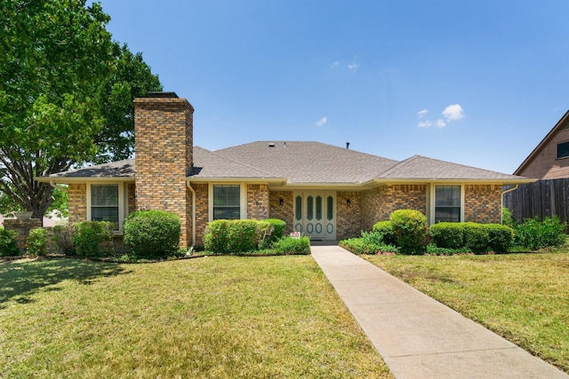 ranch-style home featuring a front yard