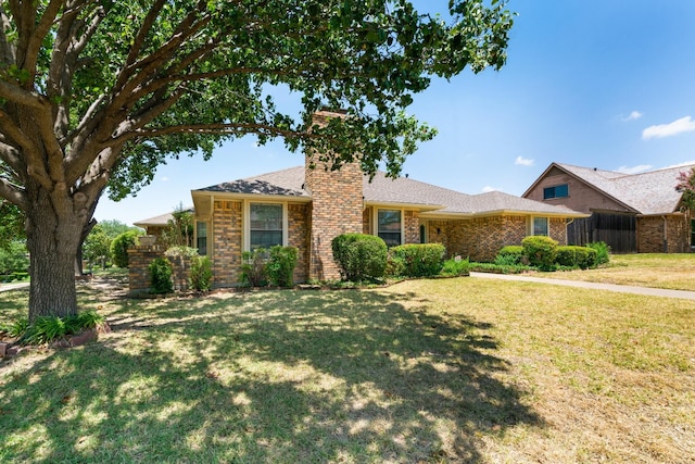 ranch-style home featuring a front yard