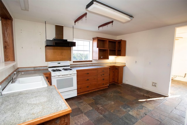 kitchen with white range with gas cooktop, sink, and wall chimney range hood