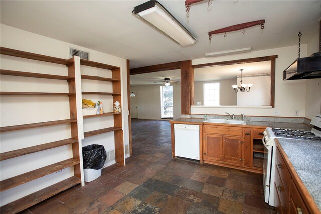 kitchen featuring ceiling fan with notable chandelier, white appliances, decorative light fixtures, and sink