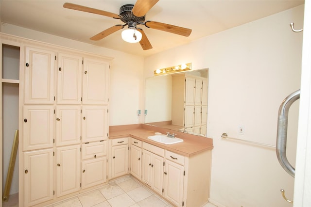 bathroom with tile patterned flooring, vanity, and ceiling fan