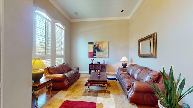 living room with crown molding and light hardwood / wood-style floors