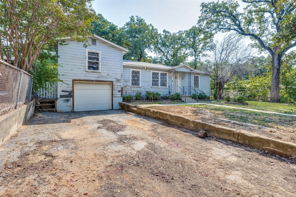 view of front of home with a garage