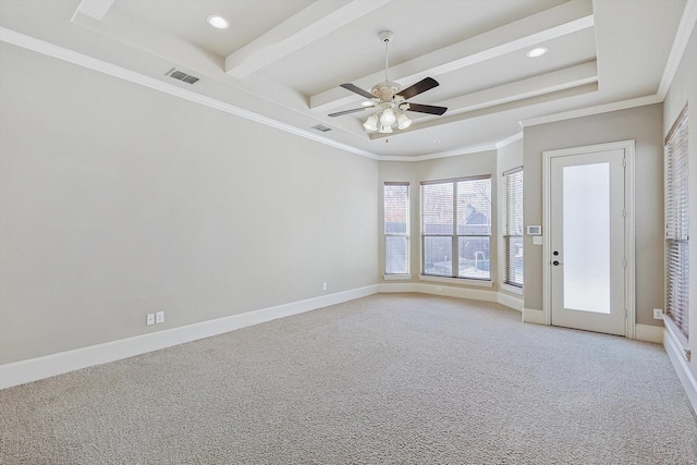 empty room featuring ceiling fan, crown molding, beamed ceiling, and light colored carpet