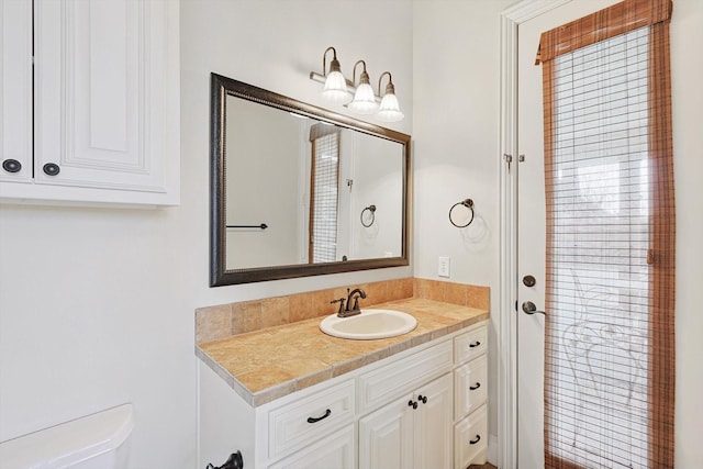 bathroom with vanity and toilet