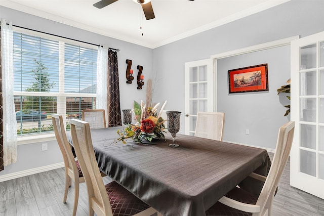 dining area with crown molding, light hardwood / wood-style flooring, and ceiling fan