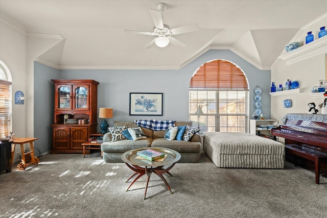 carpeted living room featuring ceiling fan, ornamental molding, and vaulted ceiling