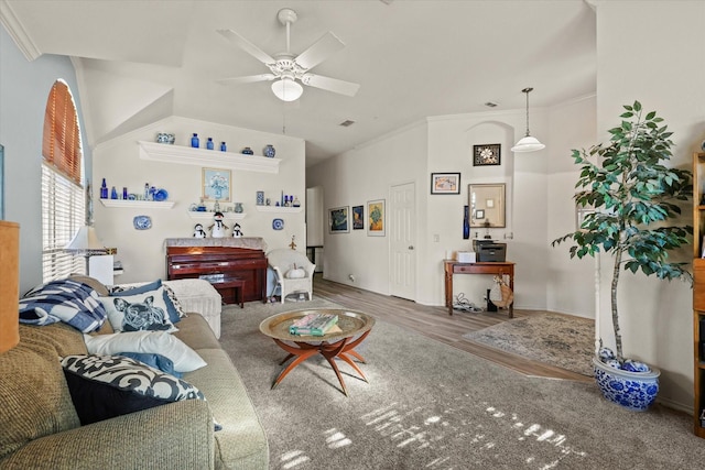 living room with ceiling fan, ornamental molding, and wood-type flooring