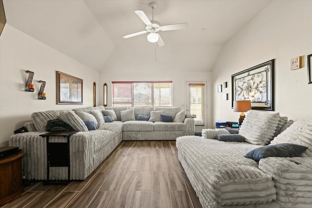 living room featuring hardwood / wood-style flooring, lofted ceiling, and ceiling fan