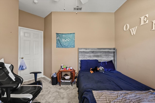 bedroom featuring light colored carpet and ceiling fan