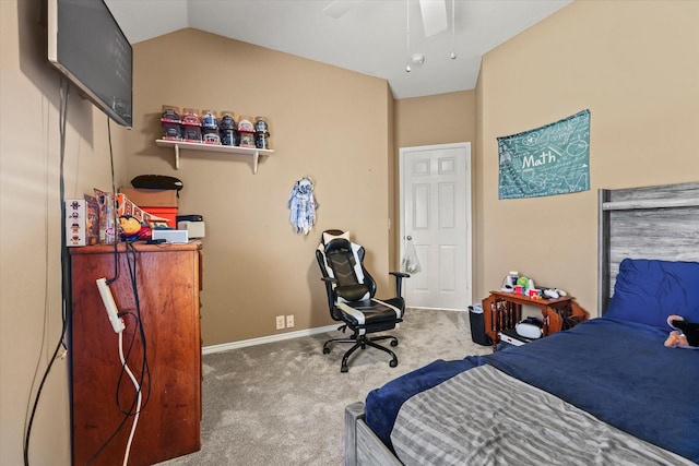 bedroom with vaulted ceiling, ceiling fan, and carpet flooring