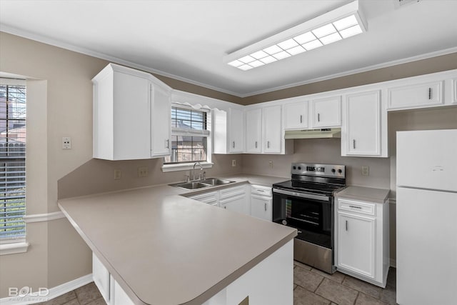 kitchen with kitchen peninsula, sink, white fridge, white cabinetry, and stainless steel range with electric cooktop