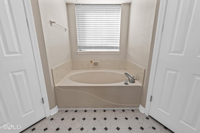 bathroom featuring a washtub