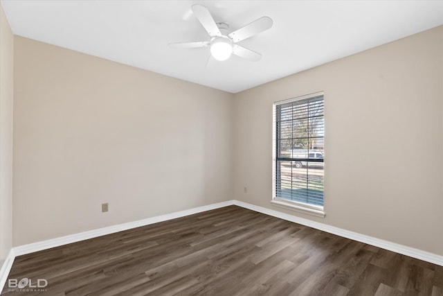 unfurnished room with dark hardwood / wood-style flooring and ceiling fan