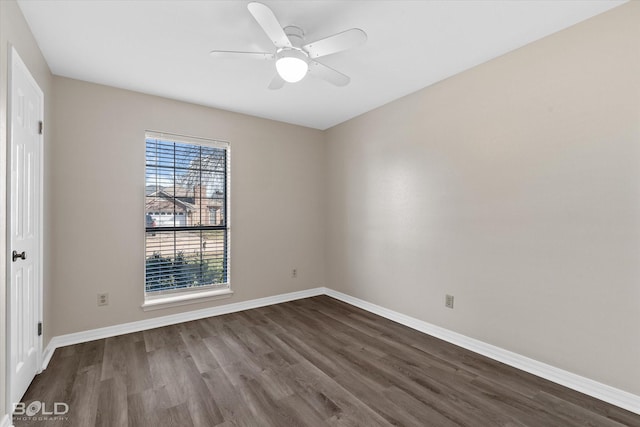 unfurnished room with dark wood-type flooring and ceiling fan