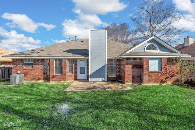 back of house with central AC, a patio area, and a lawn