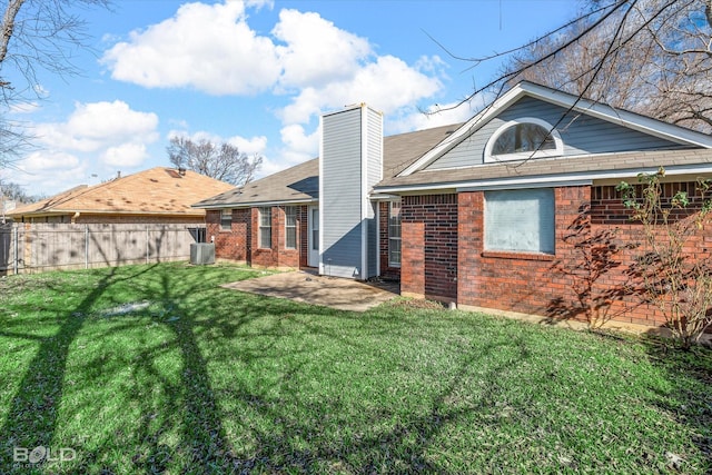 back of house featuring a yard, a patio, and central AC unit