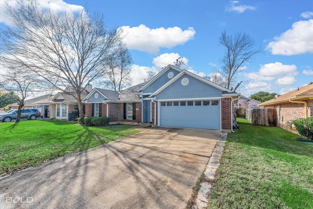 view of front of house with a garage and a front lawn