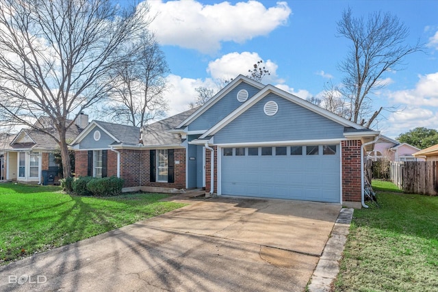 view of front of property featuring a garage and a front lawn