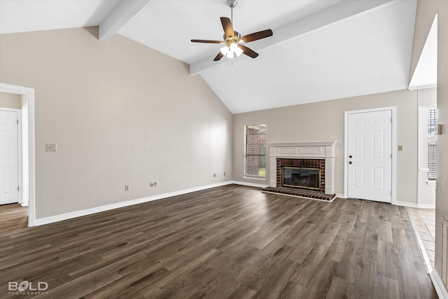 unfurnished living room featuring high vaulted ceiling, a brick fireplace, ceiling fan, beamed ceiling, and dark hardwood / wood-style flooring