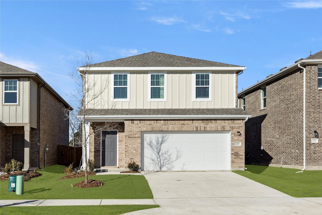 view of front property featuring a front yard and a garage