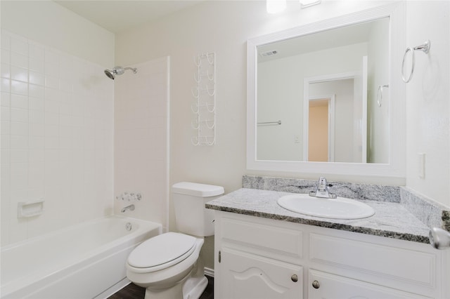 full bathroom with vanity, toilet, and tiled shower / bath