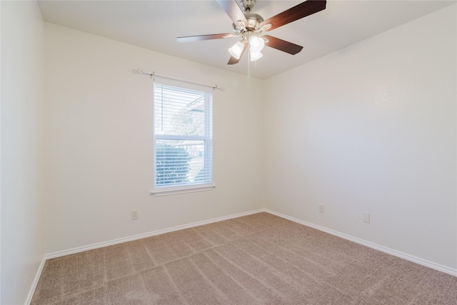 empty room with ceiling fan and light carpet