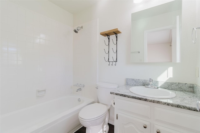 full bathroom featuring vanity, toilet, and tiled shower / bath