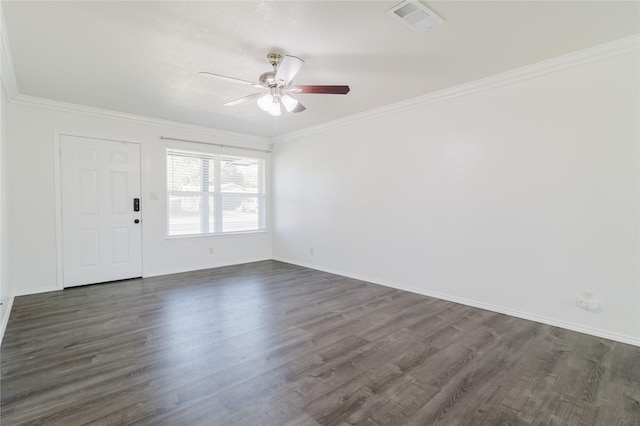 empty room with dark wood-type flooring, ceiling fan, and crown molding