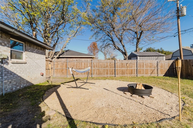 view of patio featuring an outdoor fire pit