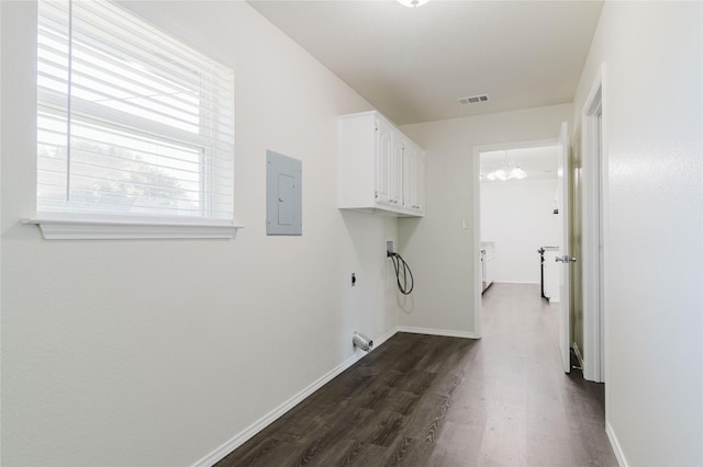 clothes washing area with dark wood-type flooring, electric dryer hookup, electric panel, cabinets, and washer hookup