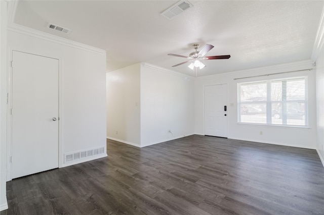 empty room featuring dark hardwood / wood-style floors, ceiling fan, and crown molding