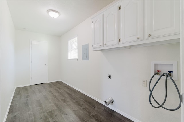 laundry room featuring electric panel, cabinets, light wood-type flooring, and washer hookup