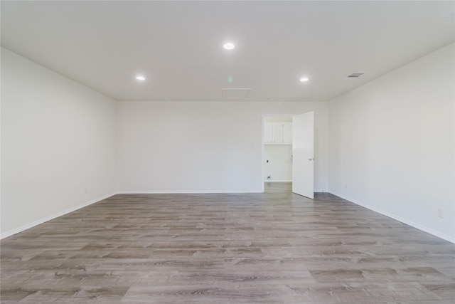 spare room with light hardwood / wood-style floors