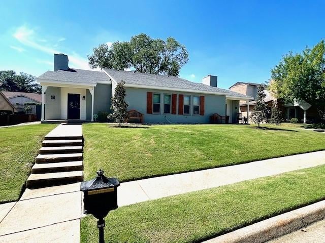 ranch-style house featuring a front lawn